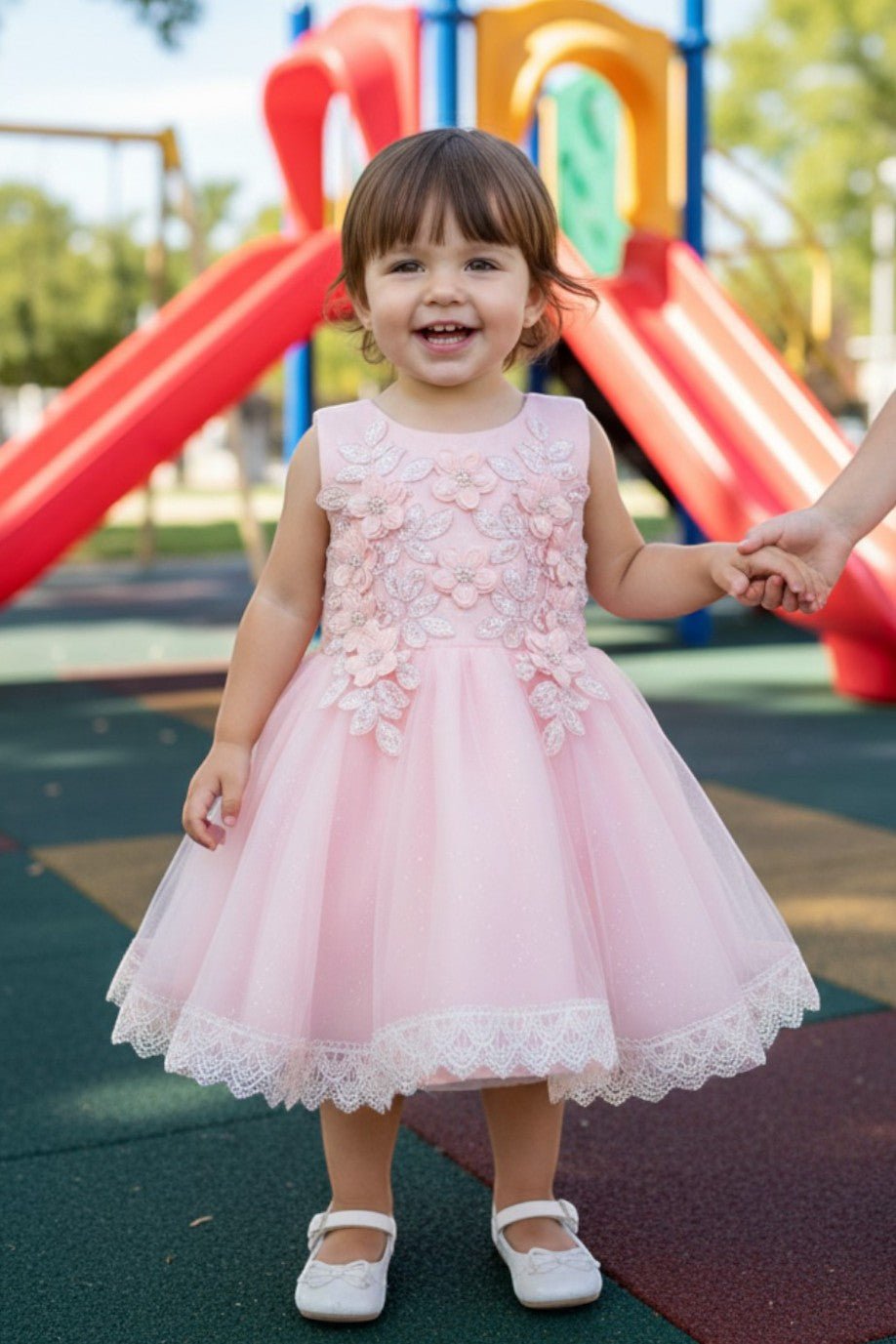 Blush flower girl Dress Front View With Embroidered Bodice And Layered Tulle Skirt.
