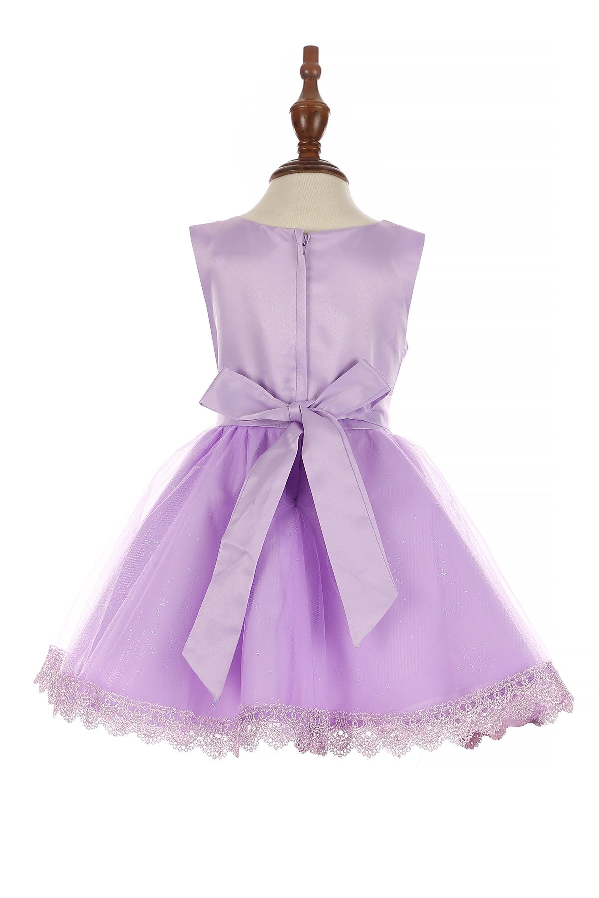 Lilac flower girl dress back view highlighting voluminous tulle skirt and elegant silhouette.