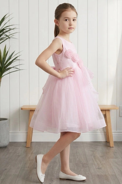 Visible on this Pink flower girl dress: layered ruffle beside the fitted bodice.