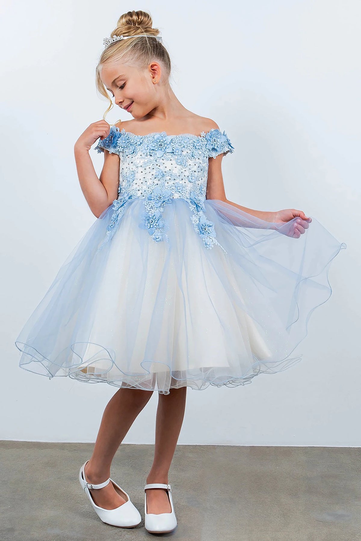A blue and white floral flower girl dress.