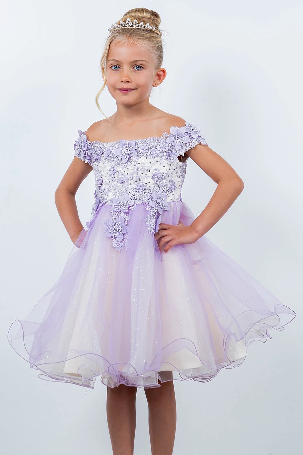 A lilac off-shoulder flower girl dress with floral embellishments.