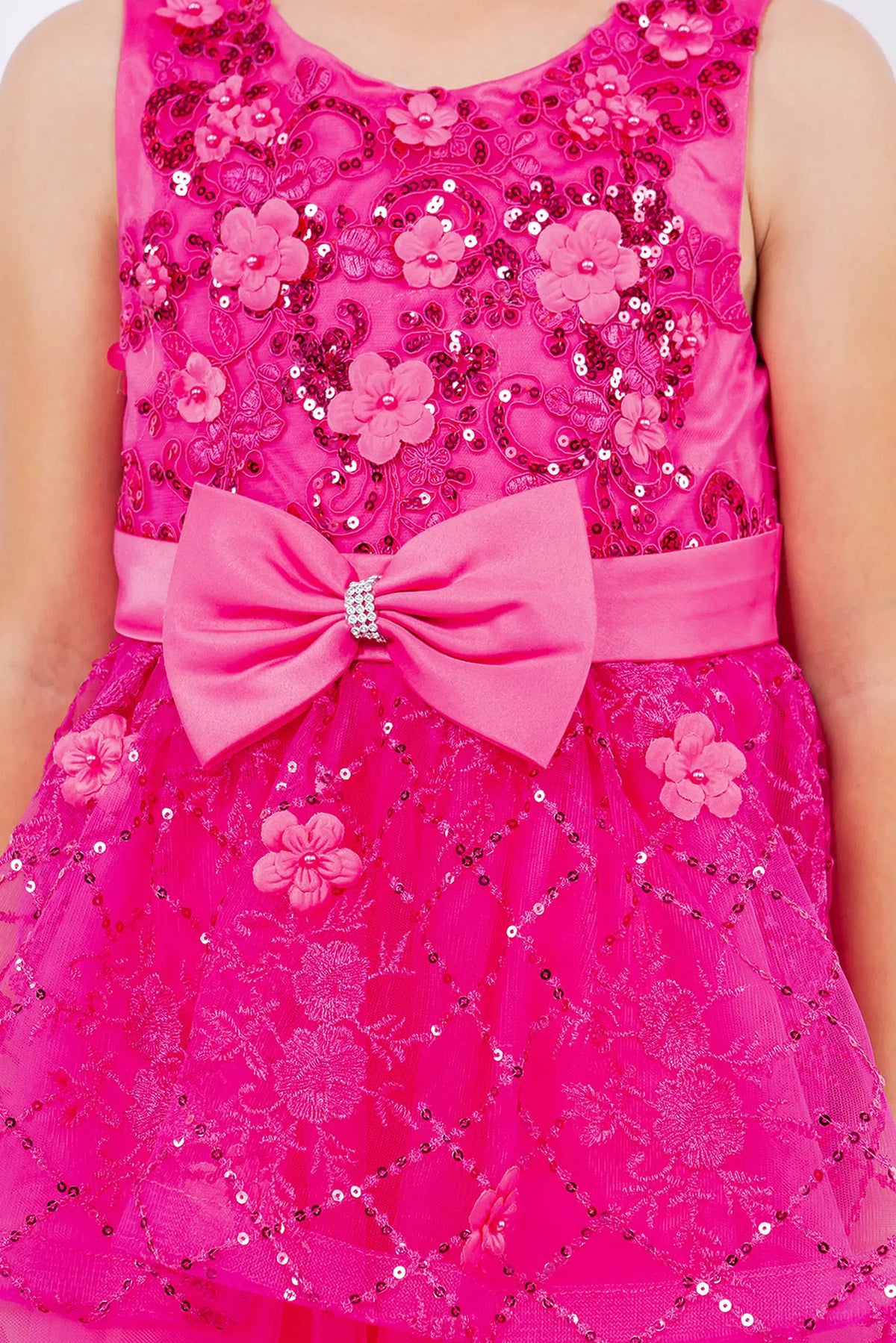 Detailed by floral accents across the bodice, the Fuchsia kids party dress reveals its construction.