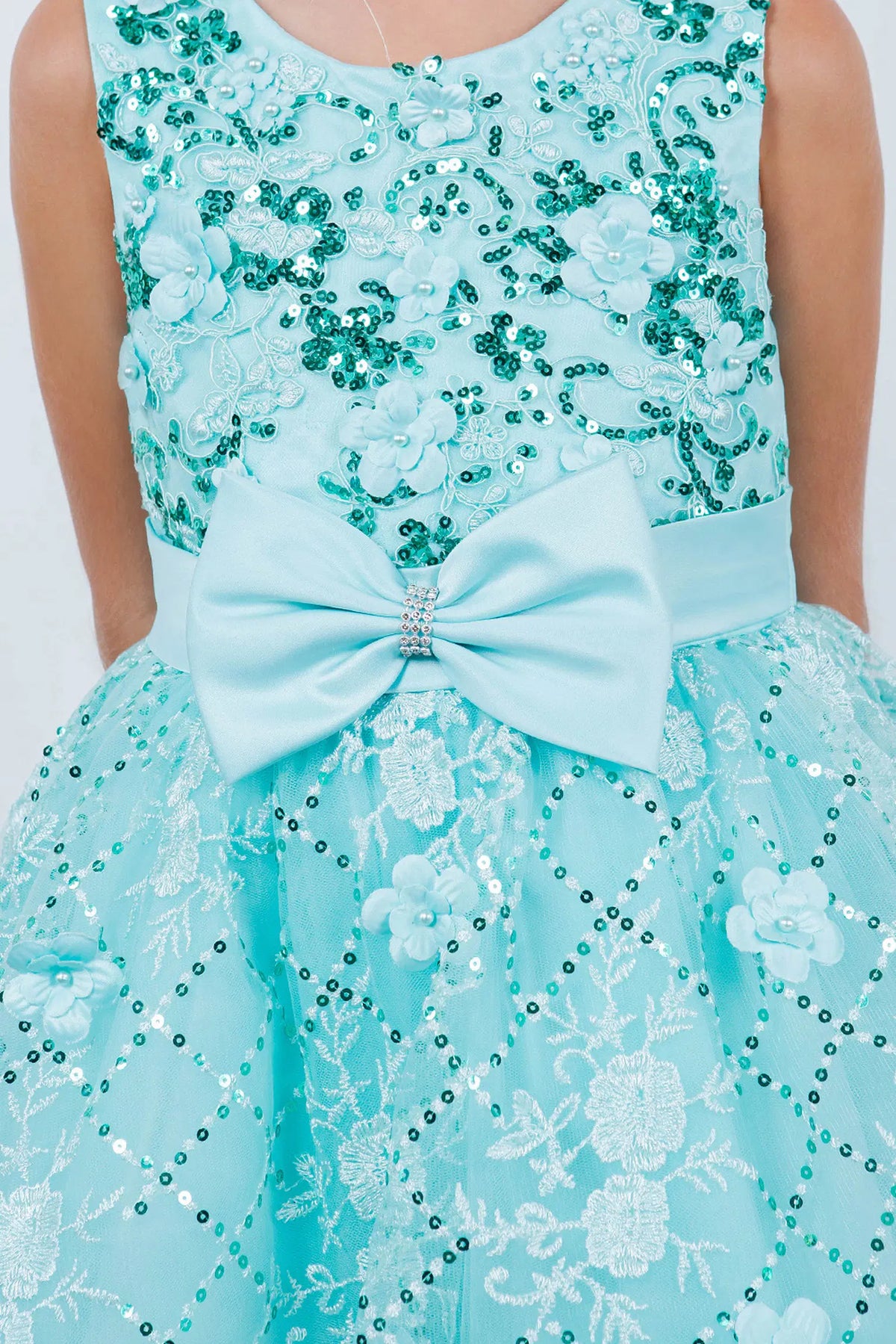 Showcasing with floral accents across the bodice, this Mint kids party dress displays elegant detail.