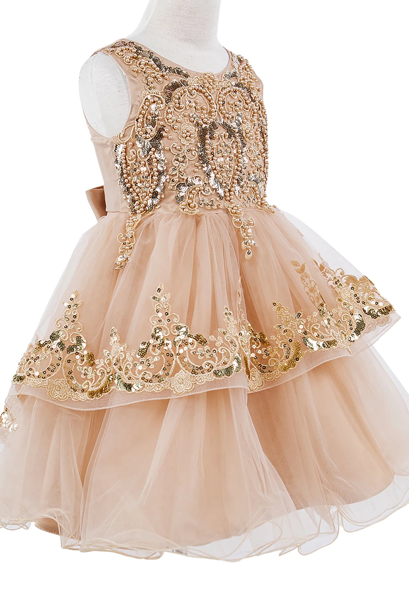 Champagne flower girl dress with gold sequin embellishments.