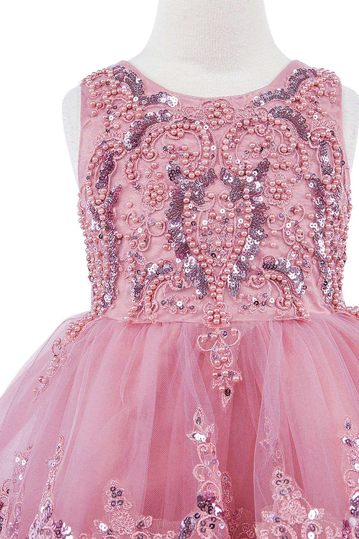 Pink flower girl dress with intricate beadwork.
