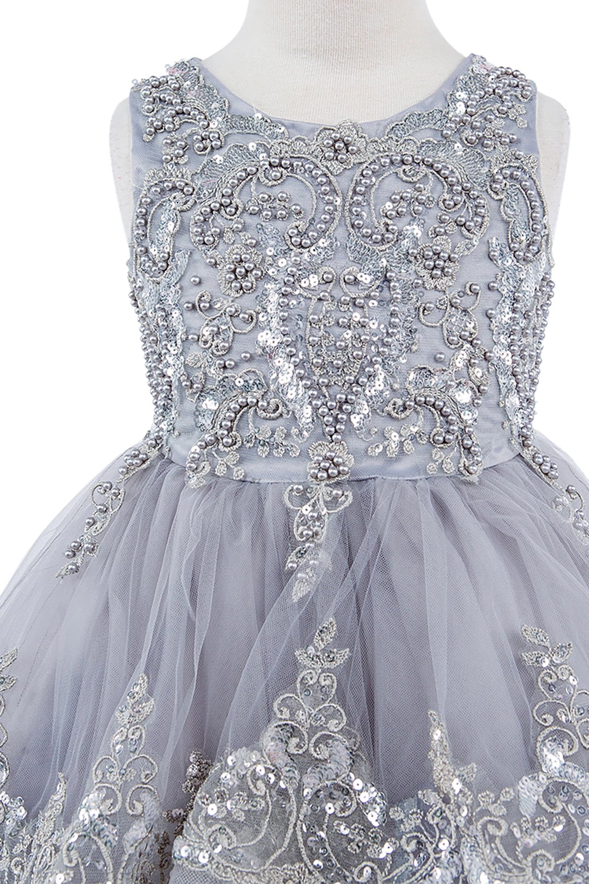 Gray flower girl dress with intricate silver beadwork.