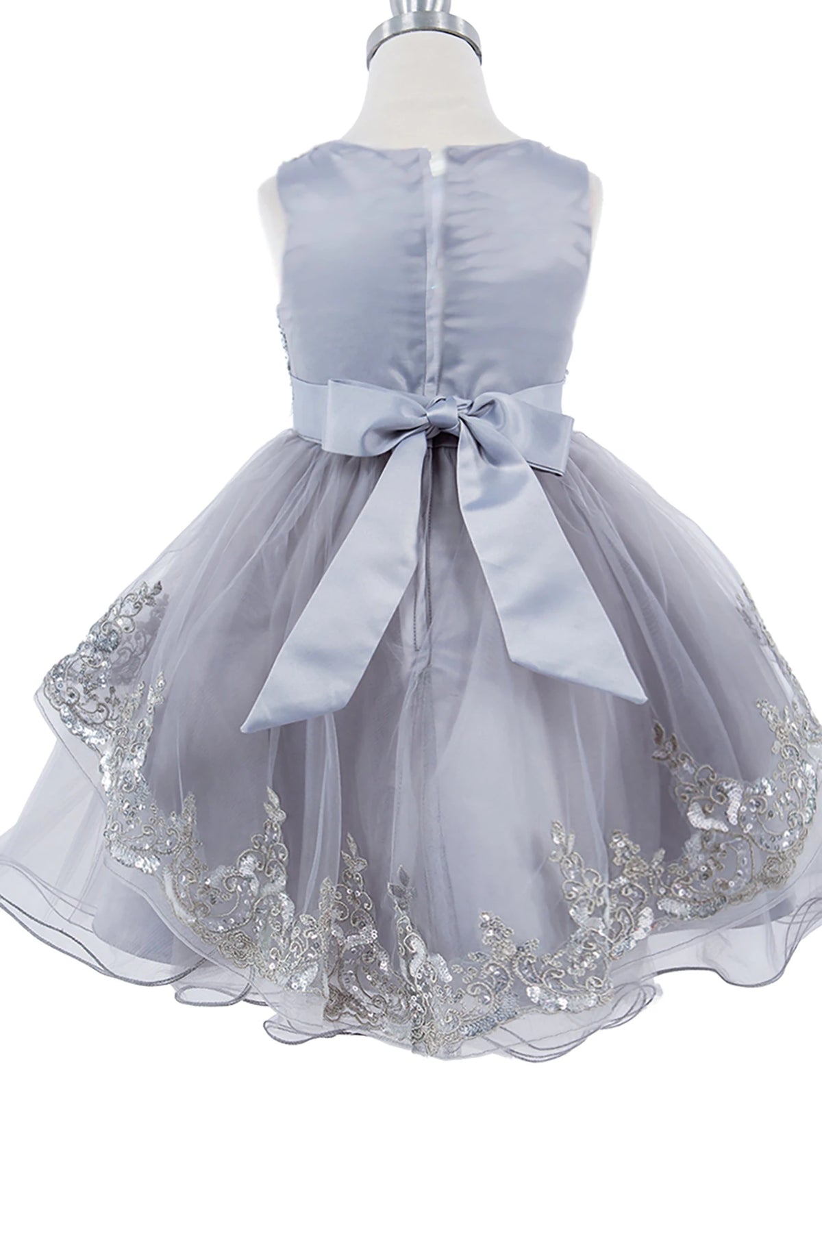 Gray flower girl dress with a large bow.
