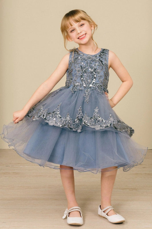 Shown in a front view, the Smoky Blue flower girl dress has beaded sleeveless bodice and full skirt with scalloped lace overlay.