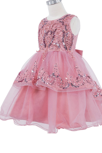 Pink dress with sequin details on a mannequin against a white background