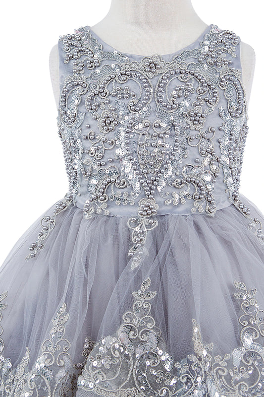 Gray dress with intricate silver beadwork on a mannequin