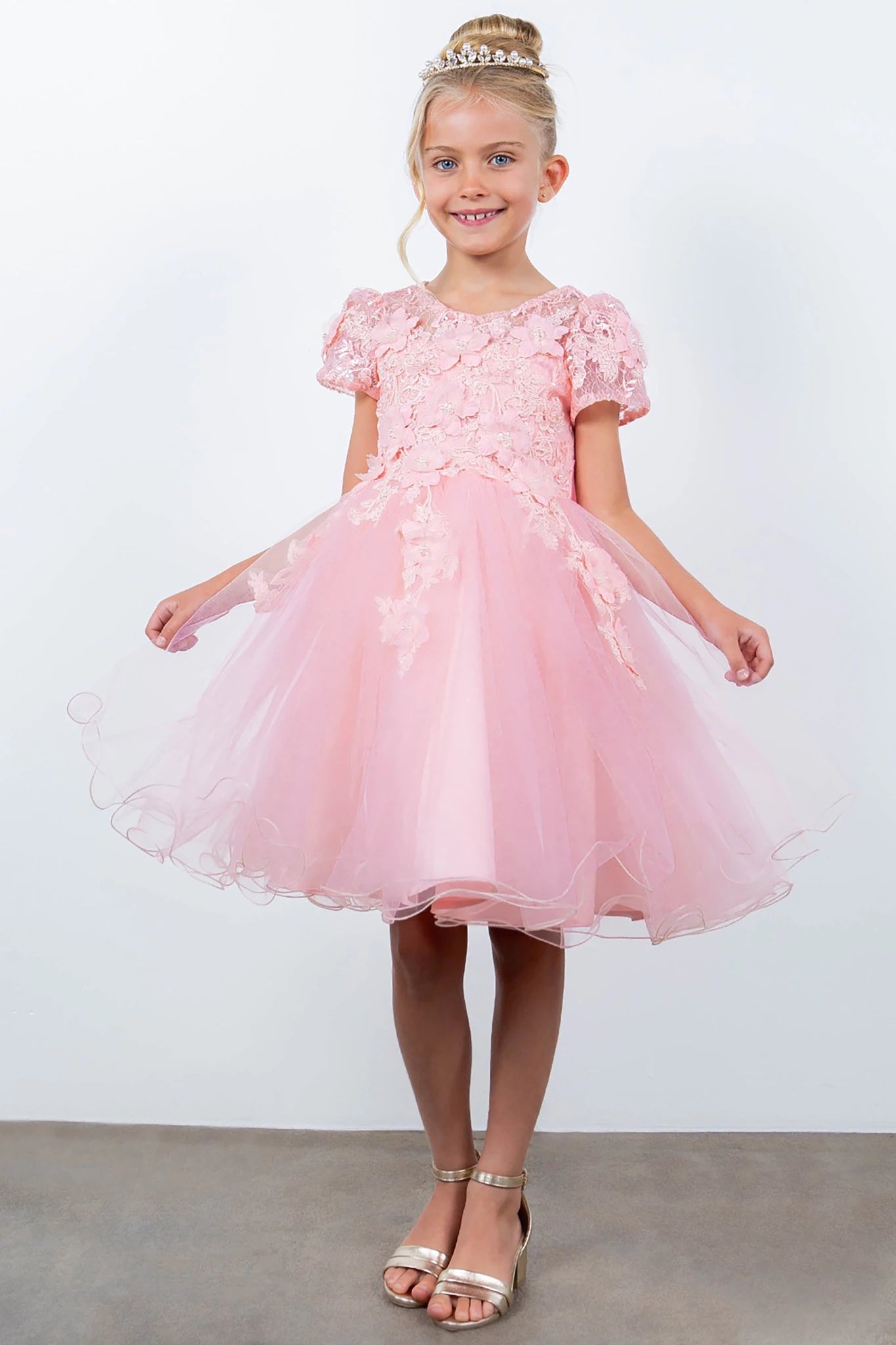 A pink floral flower girl dress.