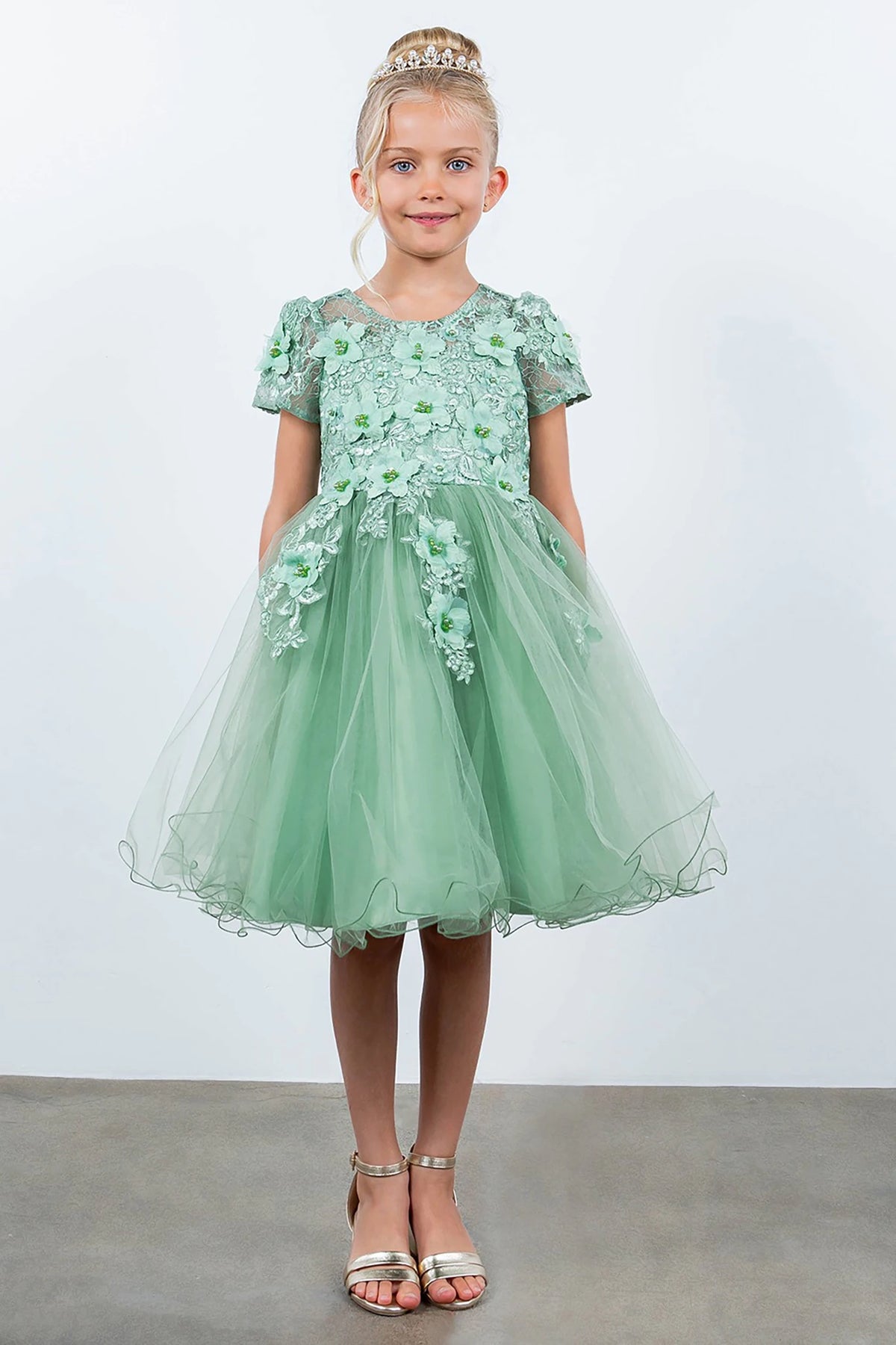A green floral flower girl dress.