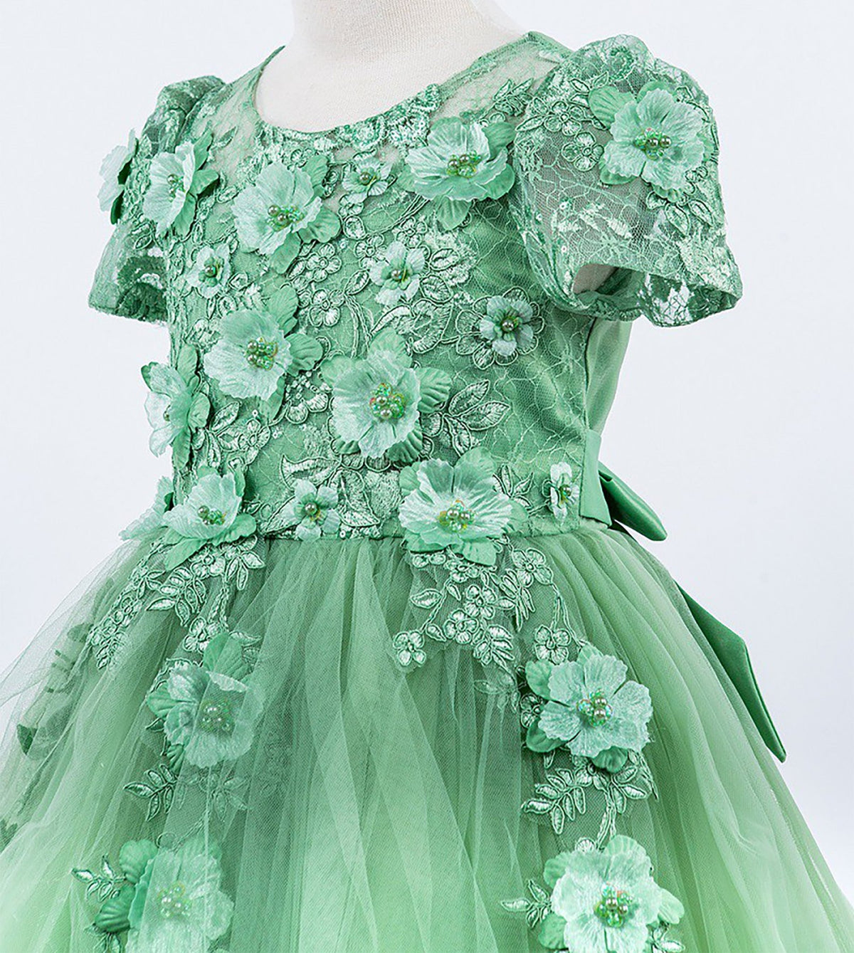 Close-up of Sage Embedded 3D Floral Cap Sleeve flower girl dress with Wired Tulle.