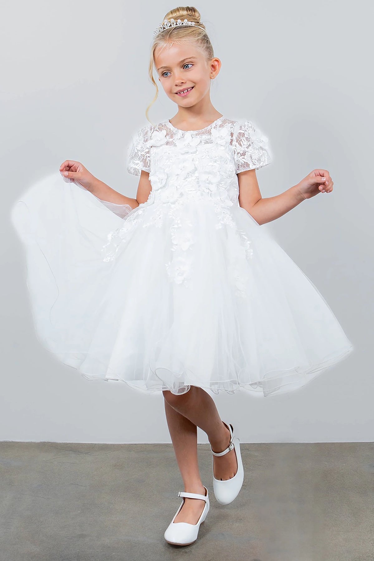 A white lace flower girl dress.