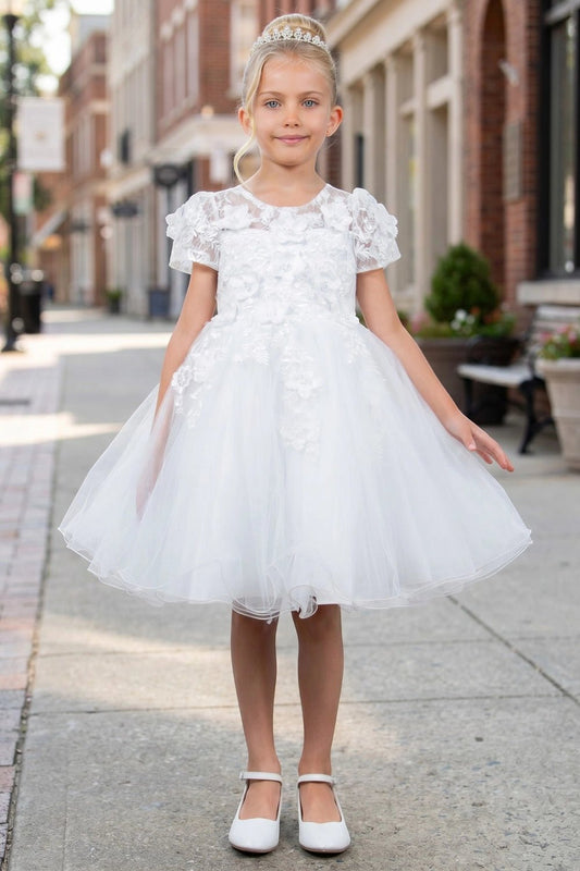 Shown in a front view, the White flower girl dress has floral cap-sleeve bodice and full layered tulle skirt.