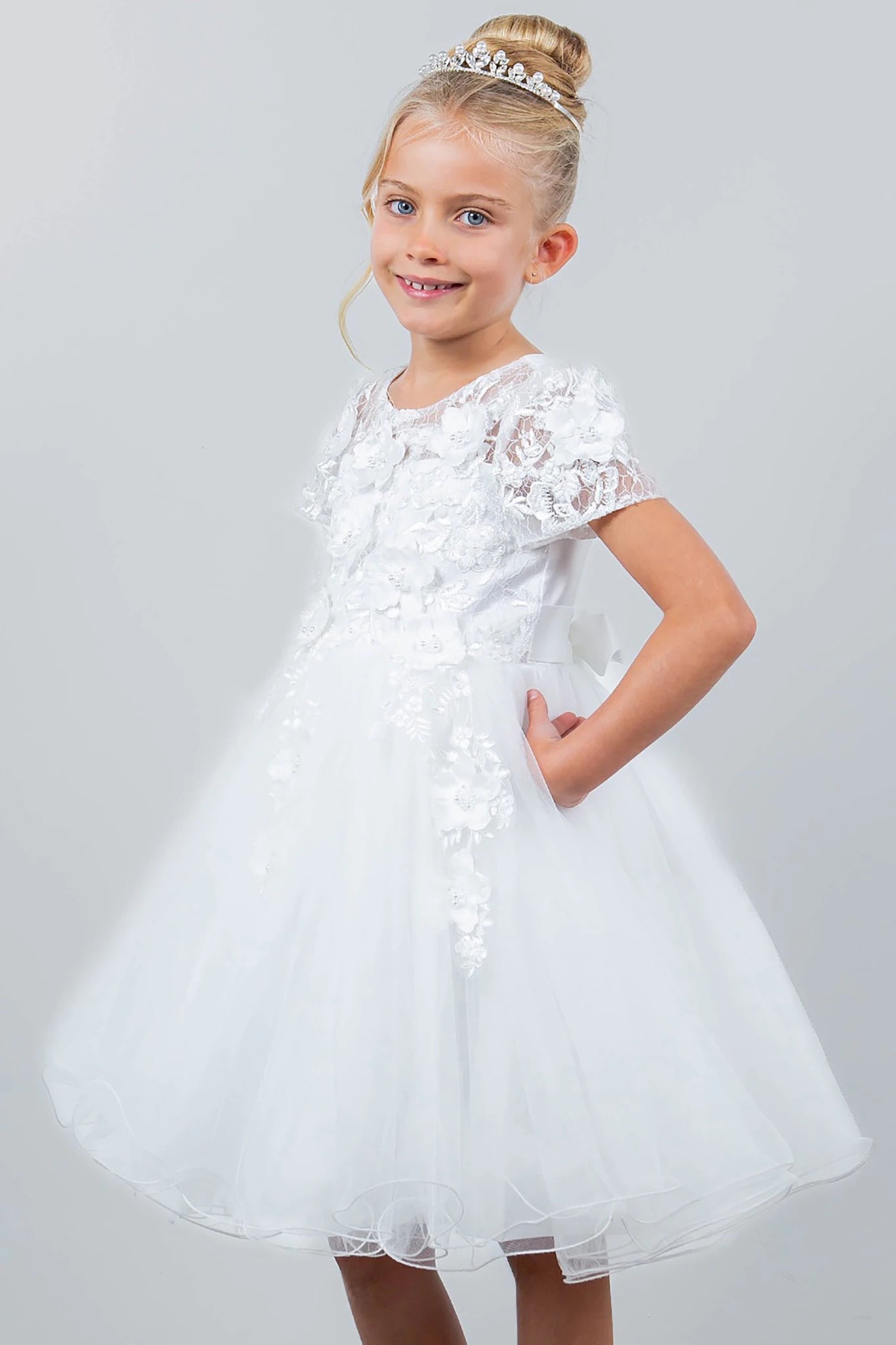 A white lace flower girl dress.
