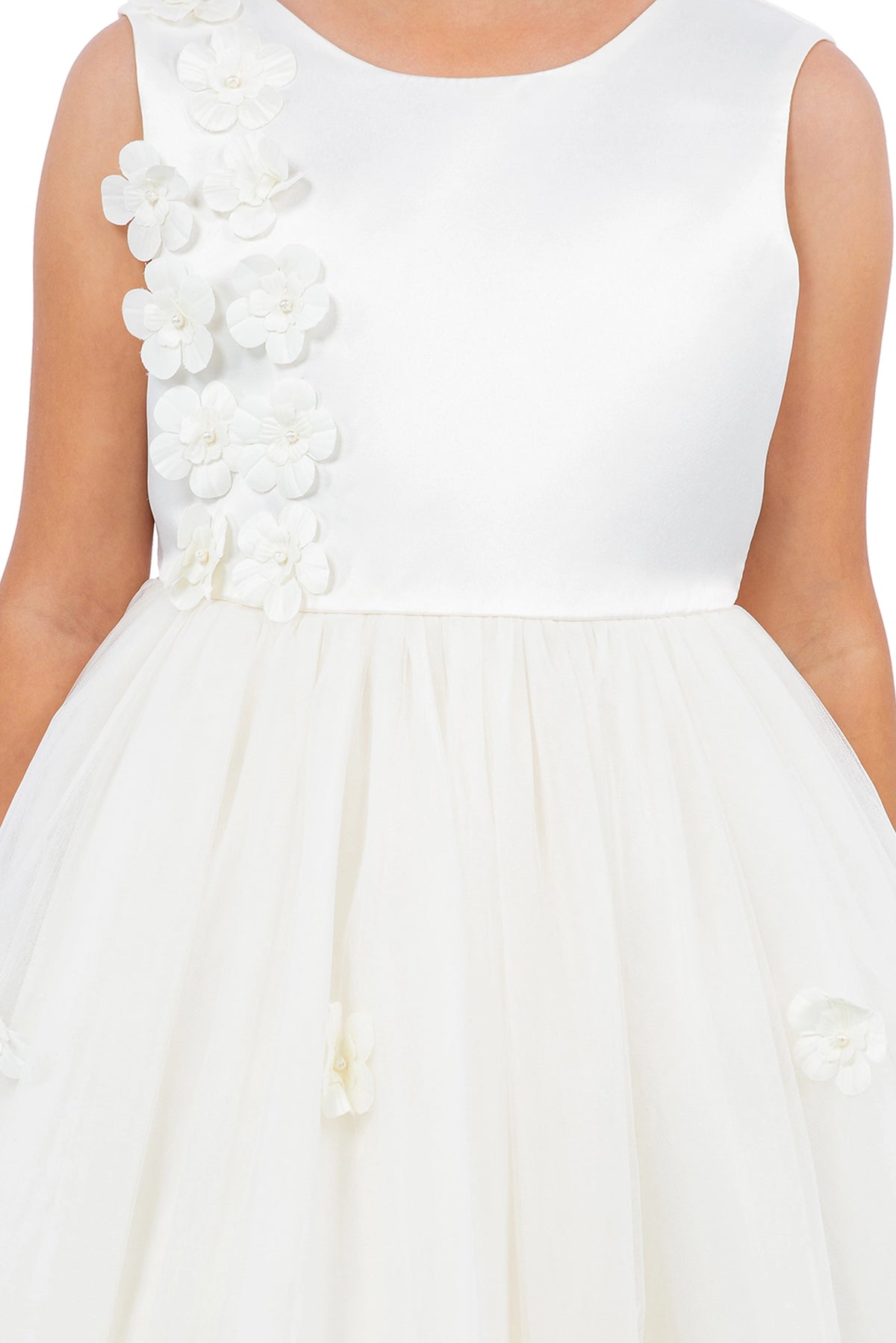 Visible on this Ivory flower girl dress: raised flowers beside the rounded neckline.