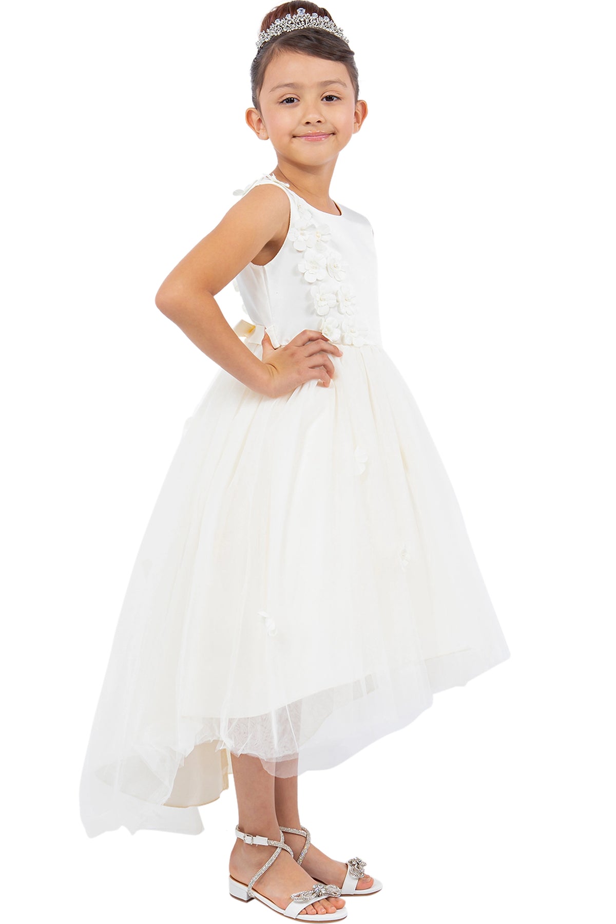 Details of the Ivory flower girl dress include floral bodice above an asymmetric tulle skirt.