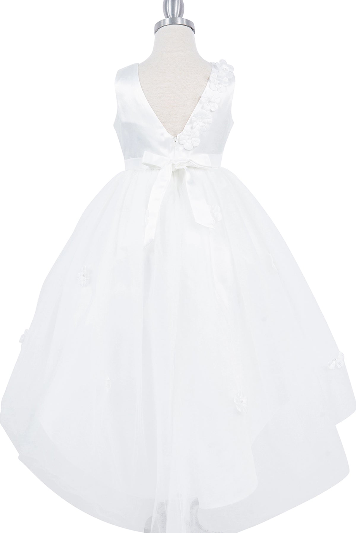 A White flower girl dress showing V back framed by raised flower appliques.