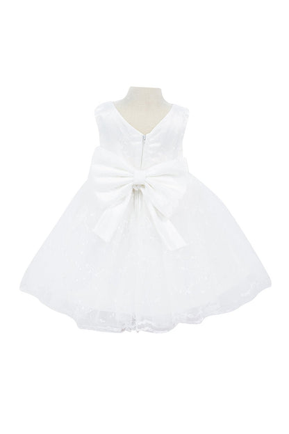 White dress back view highlighting flowing tulle skirt and elegant silhouette