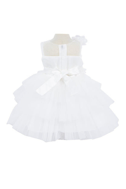 Ivory dress back view highlighting voluminous tulle skirt and elegant silhouette