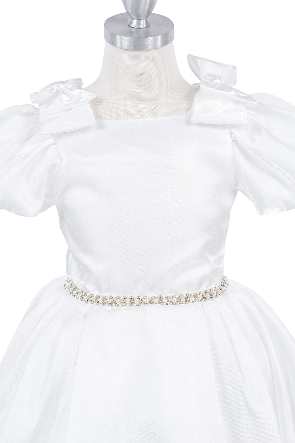 Visible on this Ivory flower girl dress: shoulder bows and crystal-like waist belt.