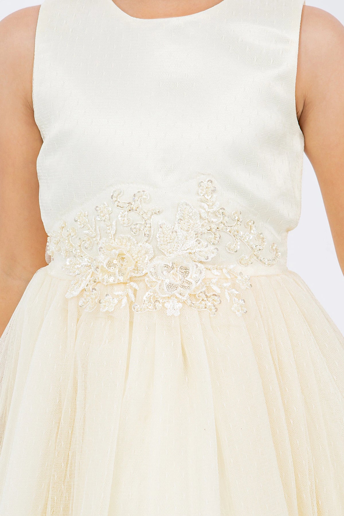 Visible on this Champagne flower girl dress: raised floral trim running around the waist.