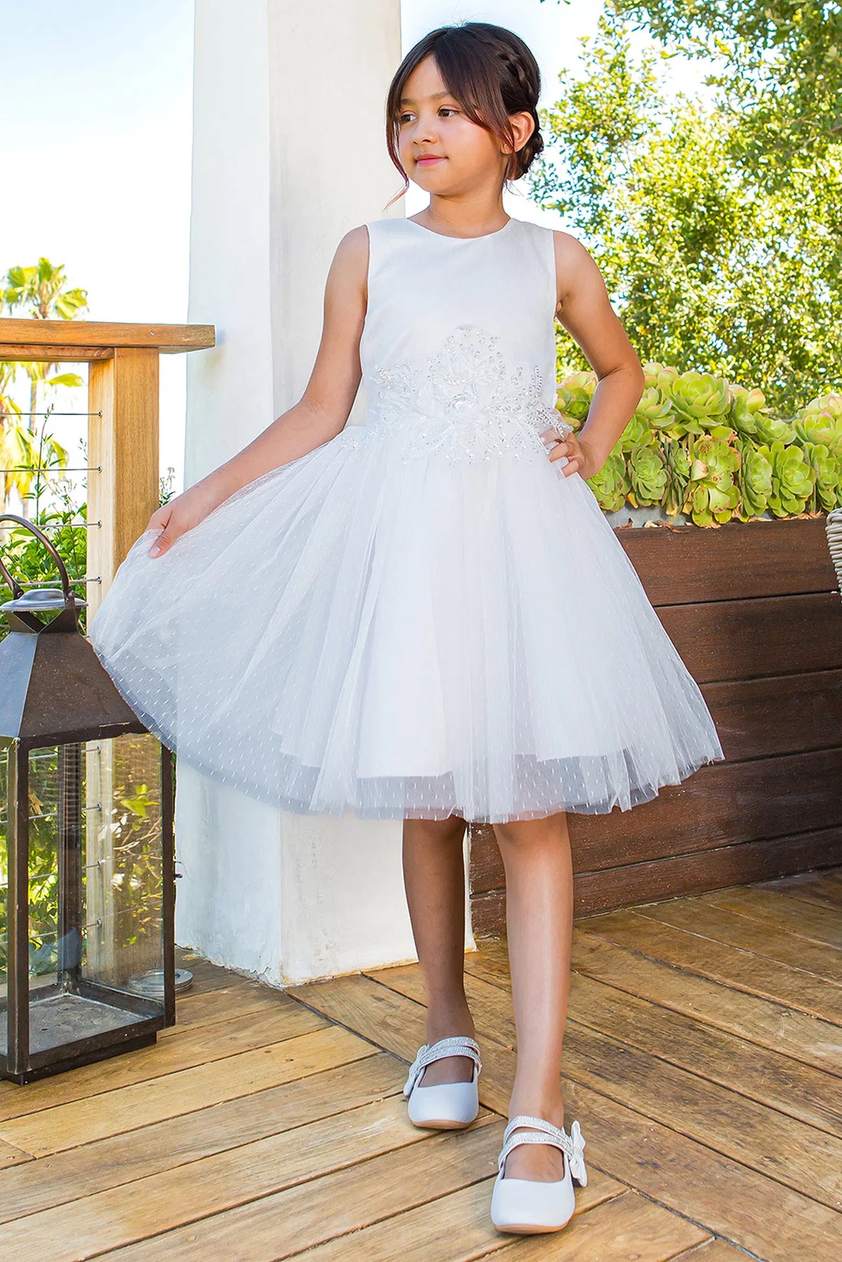 Featuring satin bodice and flared tulle skirt on the White flower girl dress.