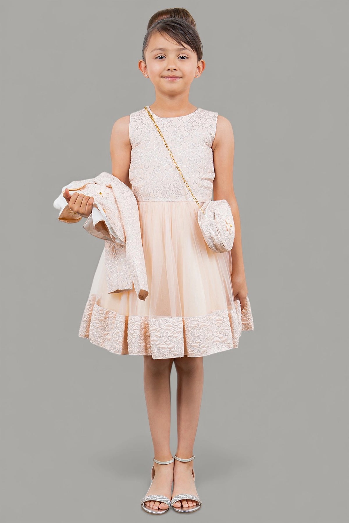 Showcasing with a cropped matching jacket, this Pink kids party dress displays elegant detail.