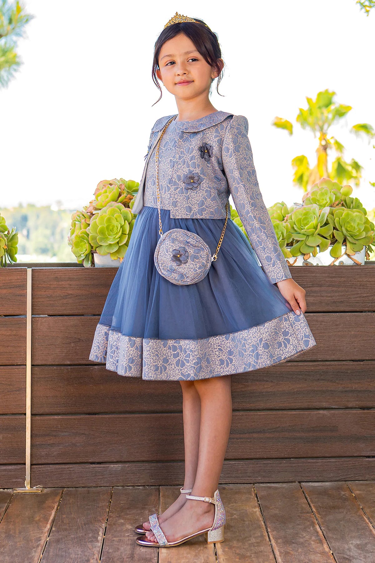 Accented a floral jacquard skirt adds character to this Royal Blue kids party dress.