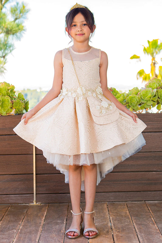 Showcasing with a high-low jacquard skirt, this Champagne kids party dress displays elegant detail.