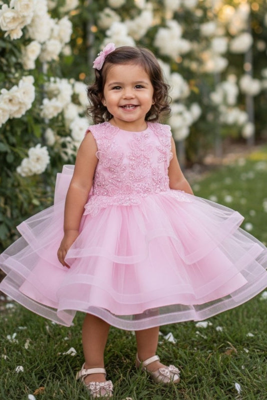 Kid Wearing Pink Flower Girl Dress Front View With Embroidered Bodice And Layered Tulle Skirt