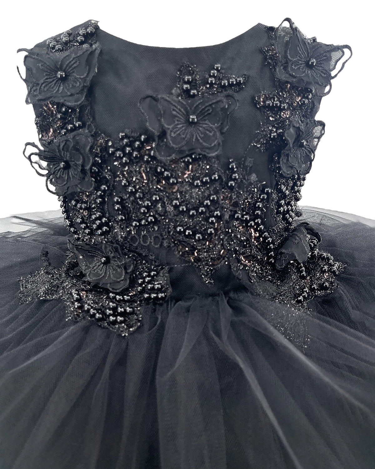 Black flower girl dress with floral and butterfly embellishments.