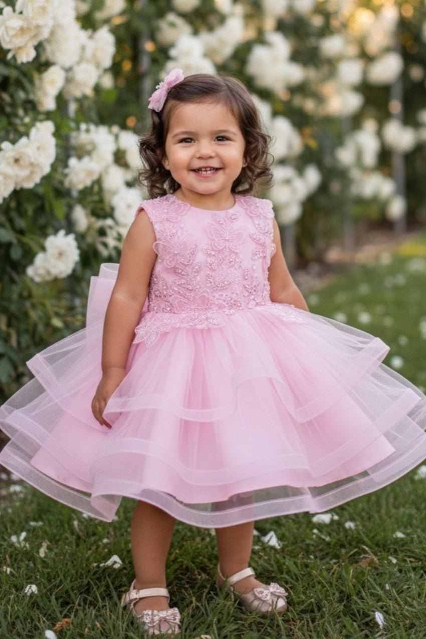 Pink flower girl Dress Front View With Embroidered Bodice And Layered Tulle Skirt.