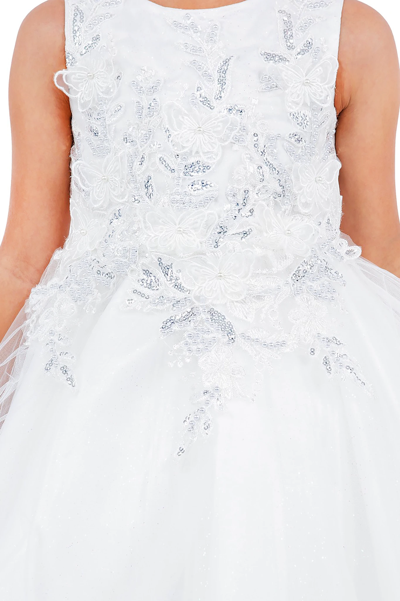 White lace flower girl dress with a close-up of the intricate detailing.