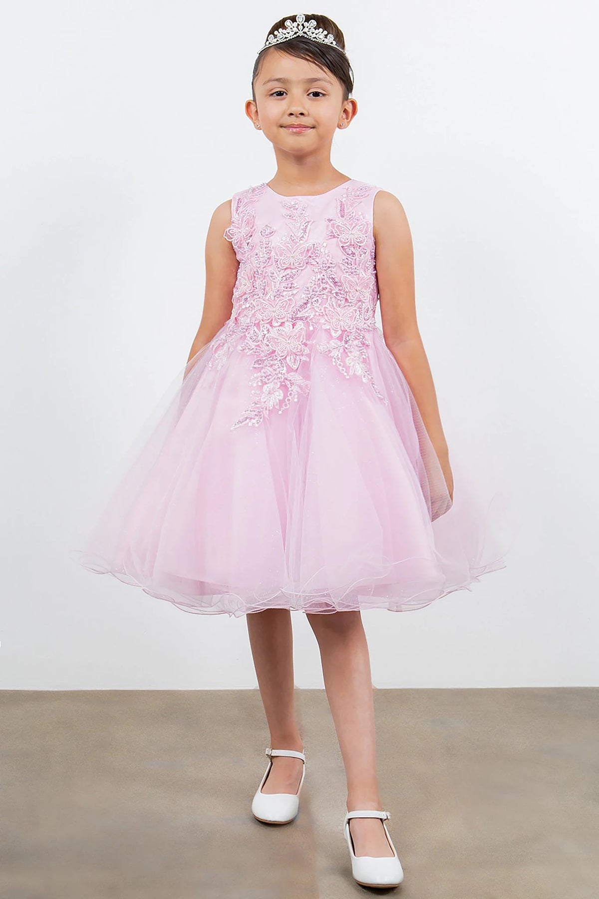 A pink floral flower girl dress.