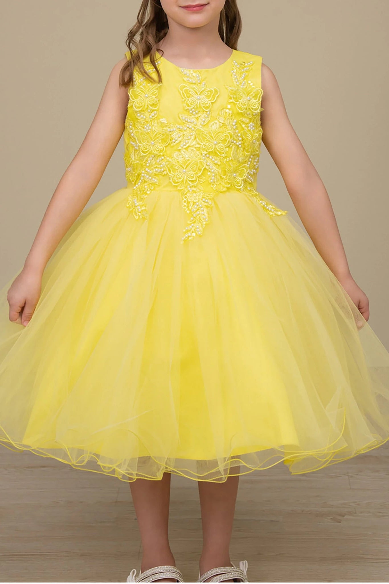 Yellow flower girl dress with floral lace top and tulle skirt.