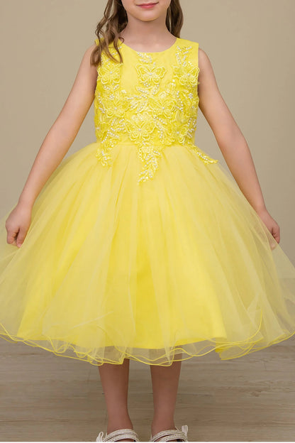 Skirt detail shows Yellow Butterfly flower girl dress with floral lace top and tulle skirt.
