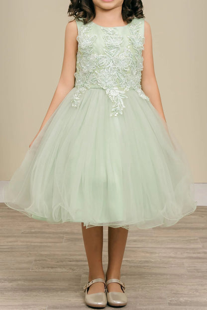 sage dress with floral lace top and tulle skirt on a neutral background