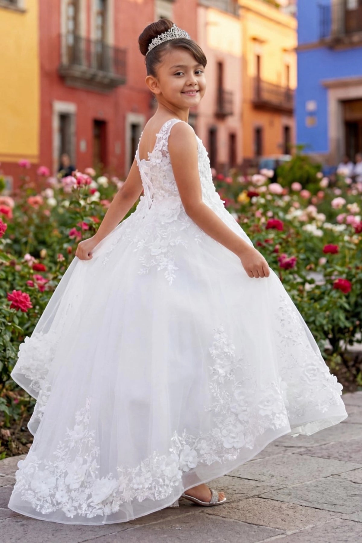 Featuring lace-trimmed skirt with a longer back hem on the Off-White flower girl dress.