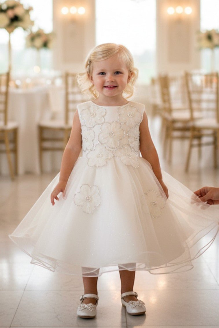 Ivory flower girl Dress Front View With Layered Skirt And Oversized Bow Detail.
