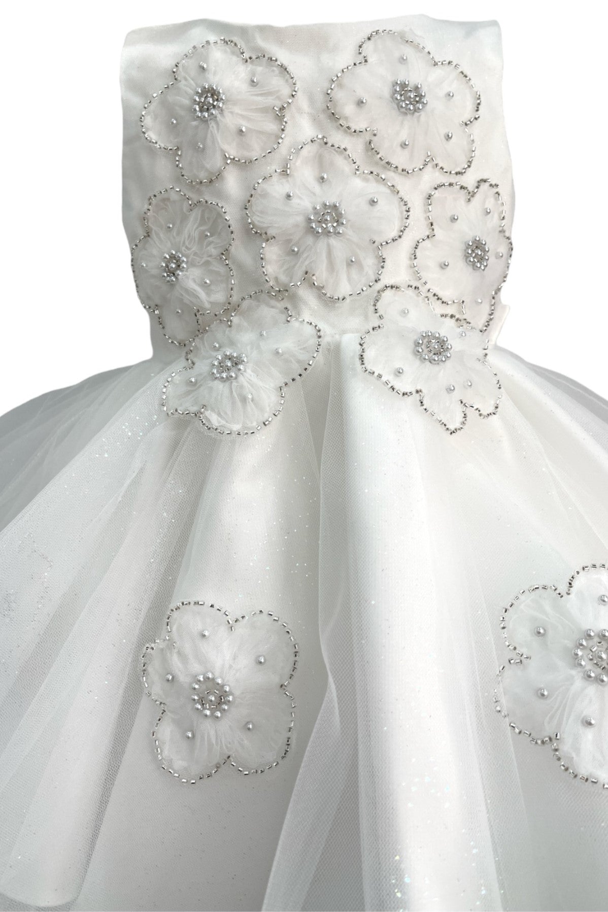 Ivory flower girl dress front view with layered skirt and oversized bow detail.