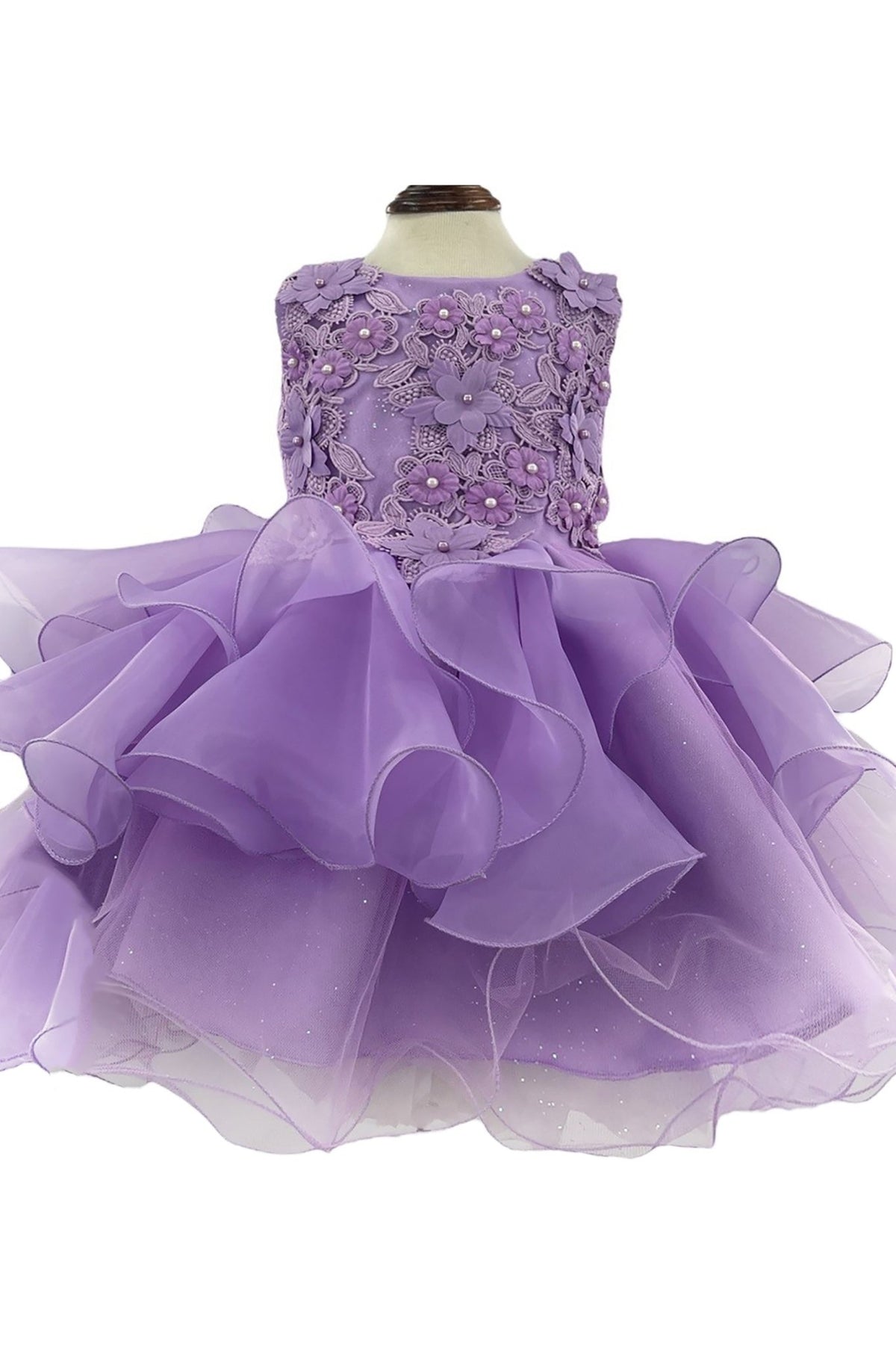 Lavender flower girl dress with floral top and ruffled skirt.