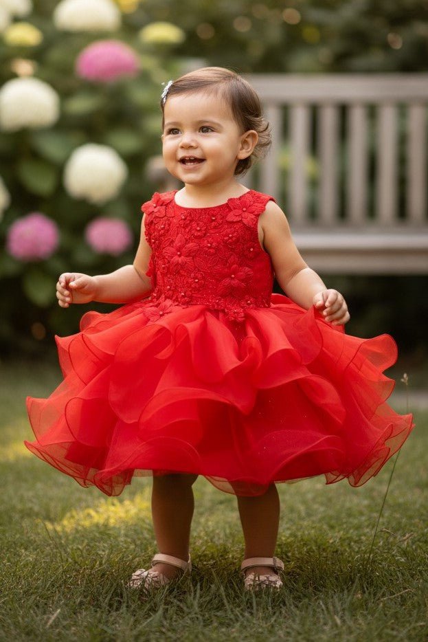 Red flower girl Dress Front View With Layered Skirt And Oversized Bow Detail.