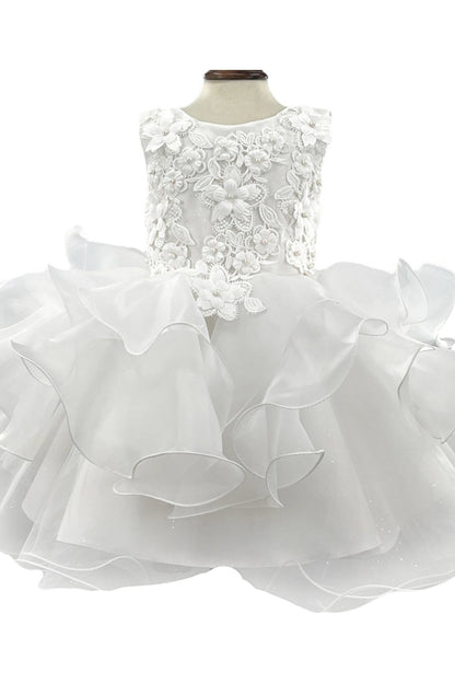 White flower girl dress with lace top and ruffled skirt on a mannequin against a white background