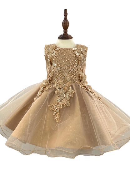 Pearl beading accents the floral bodice of the Gold flower girl baby dress above a full tulle skirt.