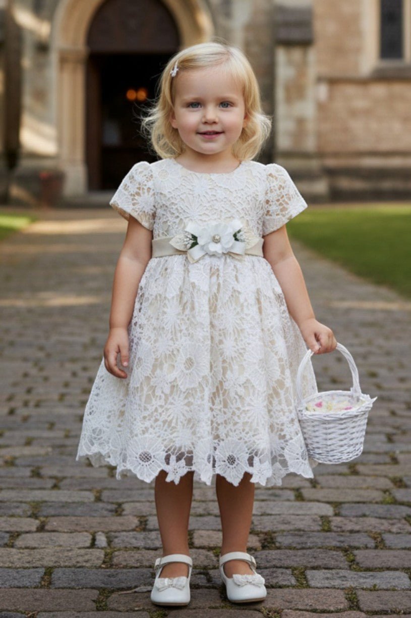 Champagne flower girl Dress Front View With Layered Skirt And Oversized Bow Detail.