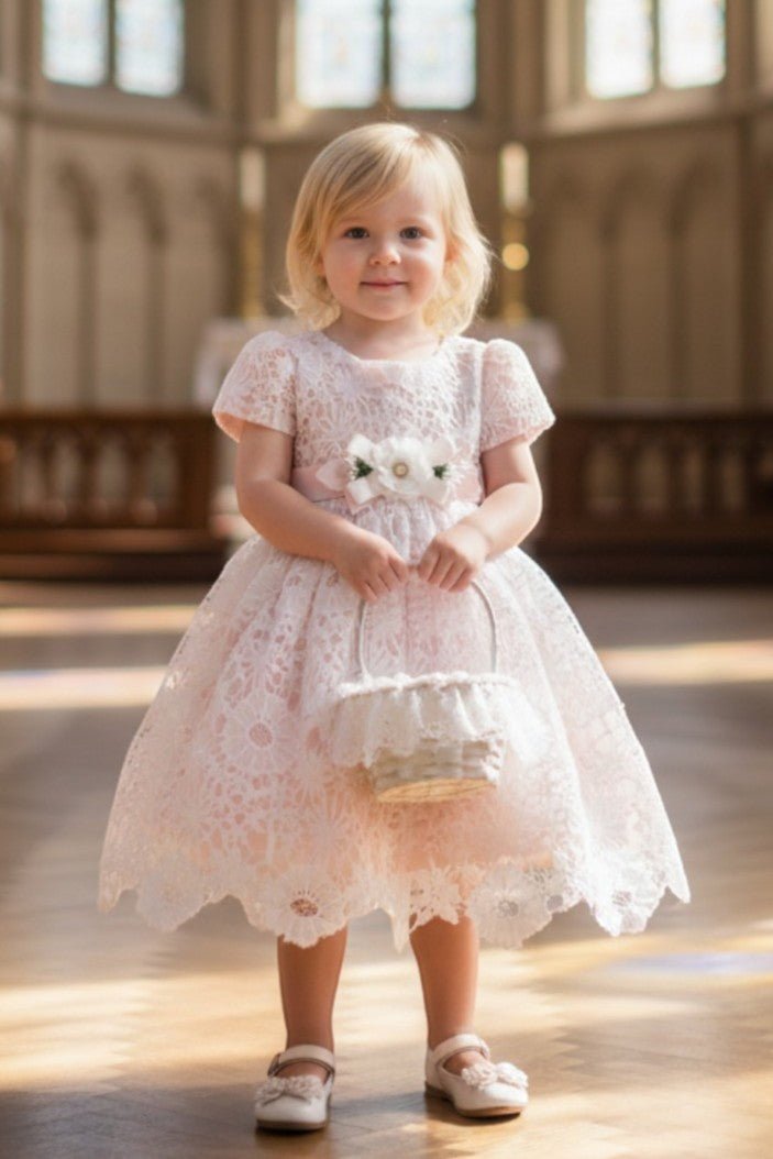 Pink flower girl Dress Front View With Layered Skirt And Oversized Bow Detail.