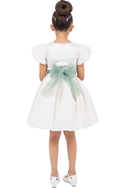 A Ivory flower girl dress showing large back bow beneath the puff sleeves.
