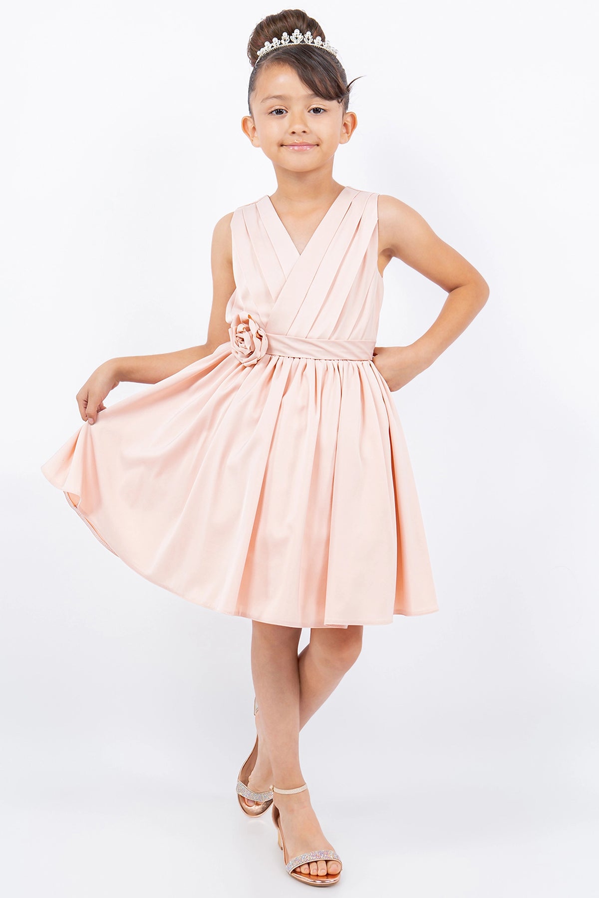 Showcasing with a rosette at the waist, this Blush kids party dress displays elegant detail.